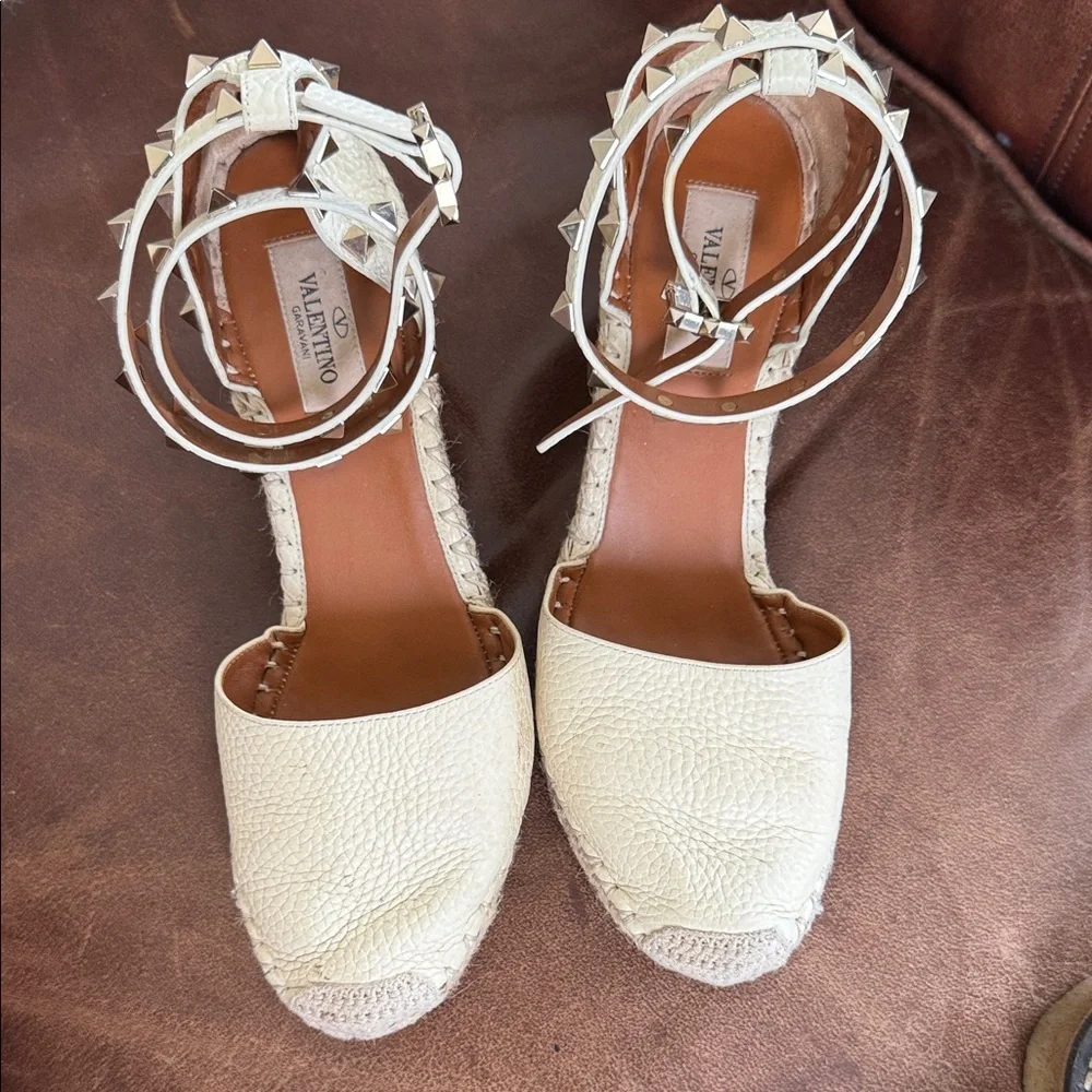 These are Valentino Garavani Rockstud textured-leather espadrille wedge heel